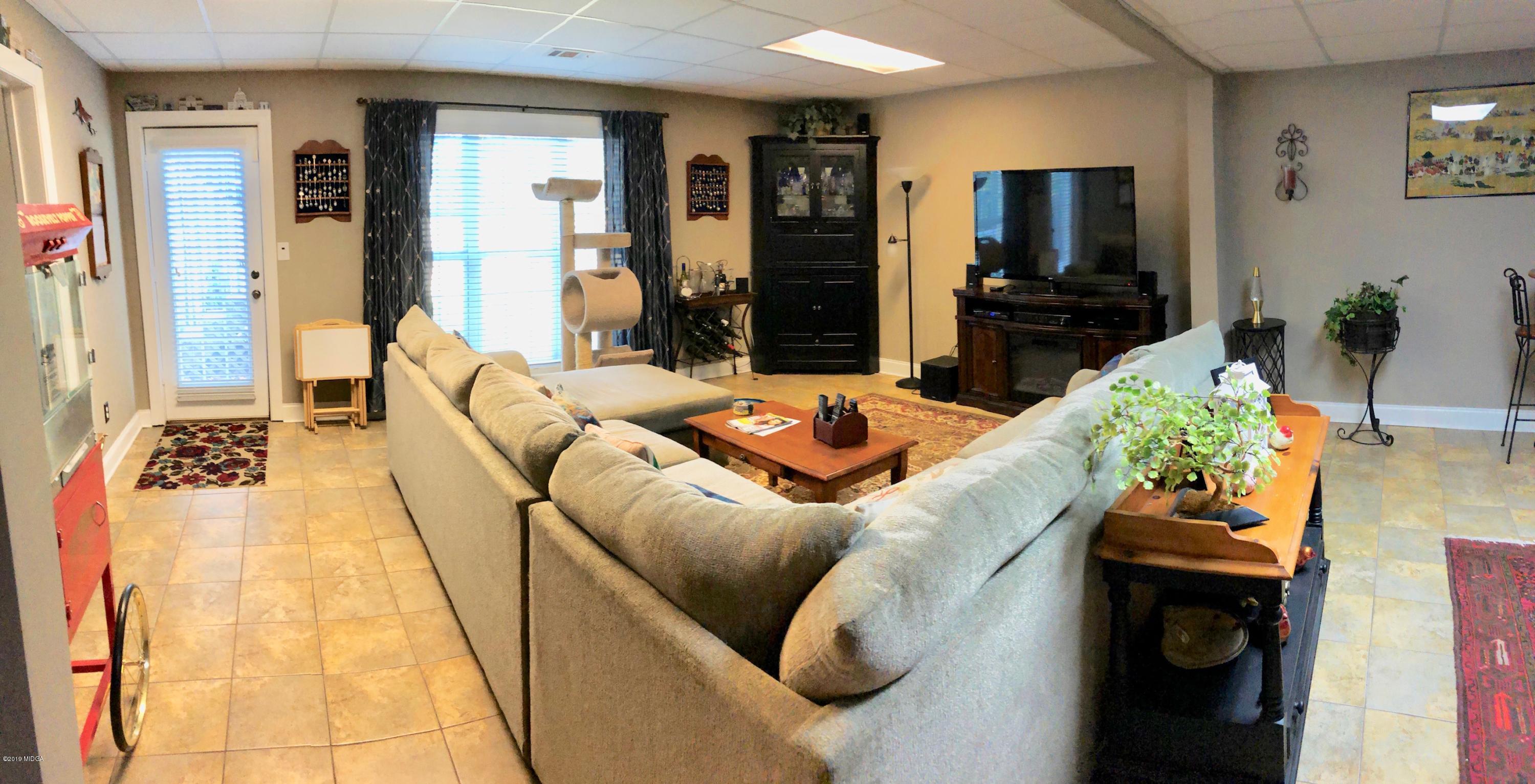 351 Eagle Ridge Road Macon, GA 31216 - Photo 27 of 33 a living room with furniture and a flat screen tv