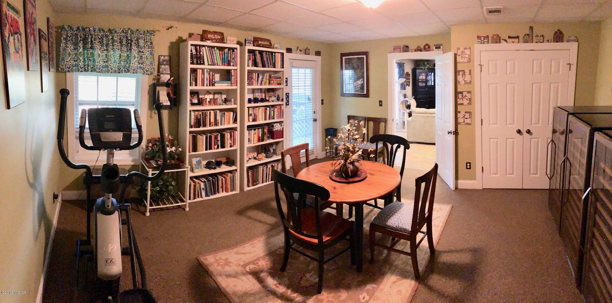 351 Eagle Ridge Road Macon, GA 31216 - Photo 28 of 33 a view of a dining room with furniture and chandelier