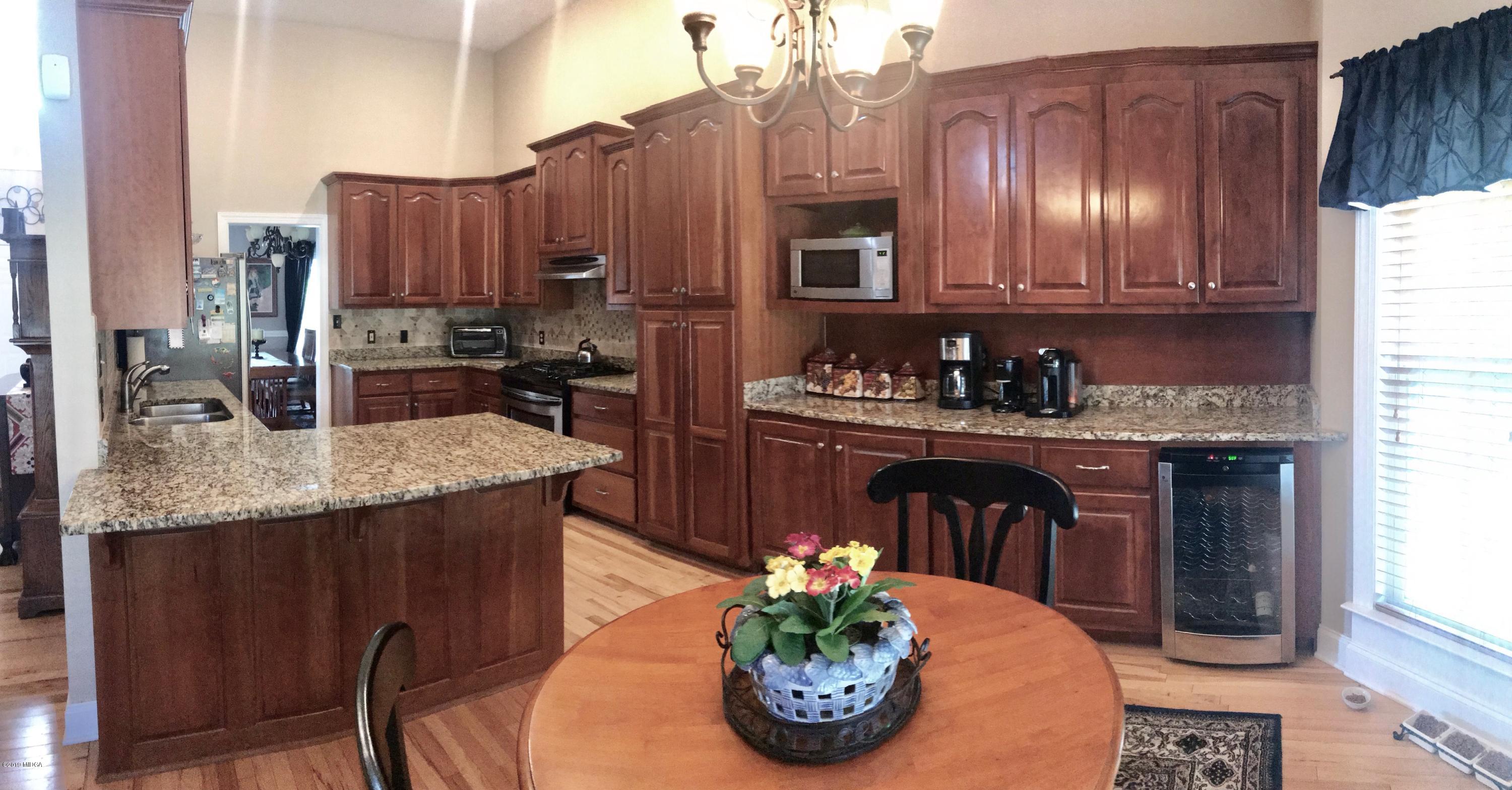 351 Eagle Ridge Road Macon, GA 31216 - Photo 6 of 33 a kitchen with a sink and cabinets
