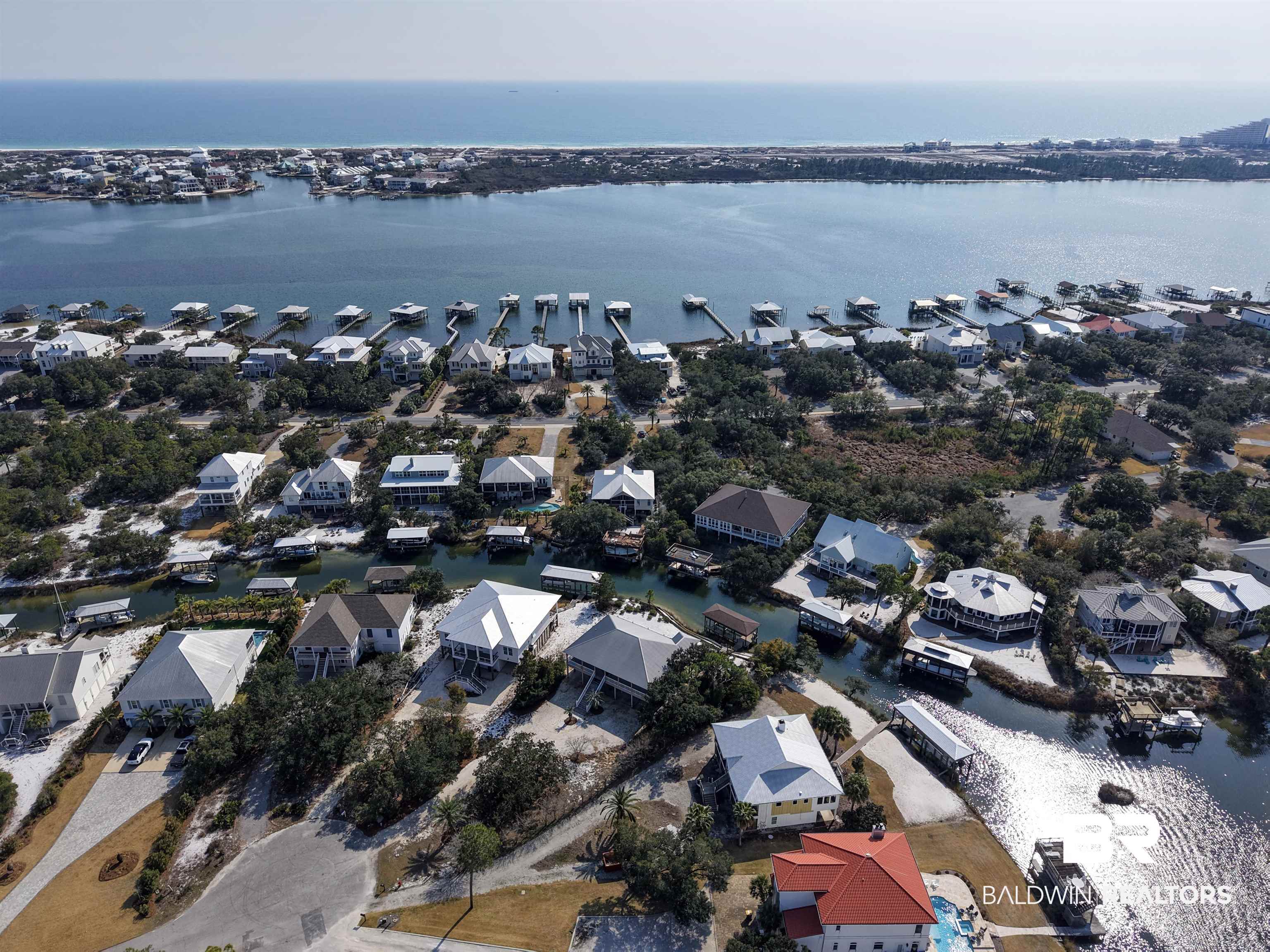 32191 River Road Orange Beach, AL 36561 - Photo 38 of 46 Aerial perspective of suburban area with a large body of water
