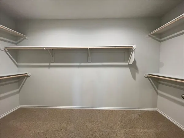 a view of an empty walk in closet