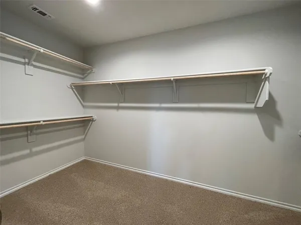 a view of an empty walk in closet