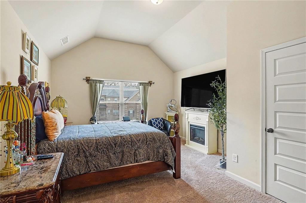 90 Waters Edge Lane Covington, GA 30014 - Photo 14 of 18 a bedroom with a bed and a flat screen tv
