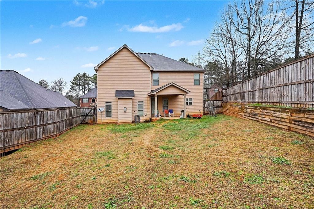 90 Waters Edge Lane Covington, GA 30014 - Photo 18 of 18 a view of a house with wooden fence