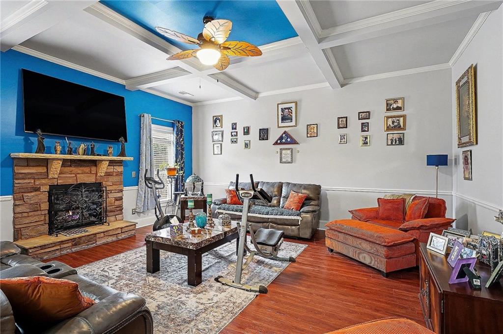 90 Waters Edge Lane Covington, GA 30014 - Photo 3 of 18 a living room with furniture a flat screen tv and a fireplace