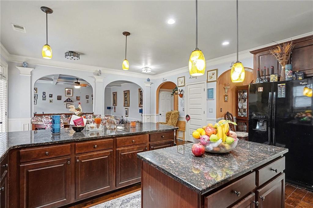 90 Waters Edge Lane Covington, GA 30014 - Photo 6 of 18 a view of a kitchen with granite countertop and living room