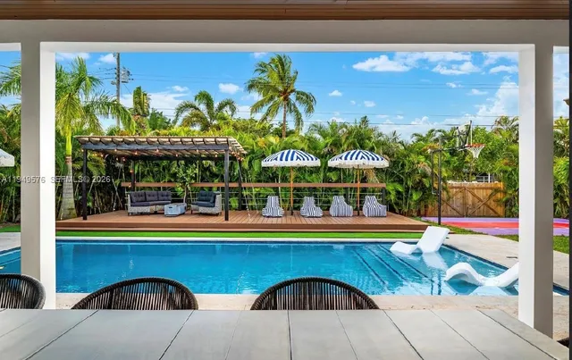 a view of a roof deck with wooden floor