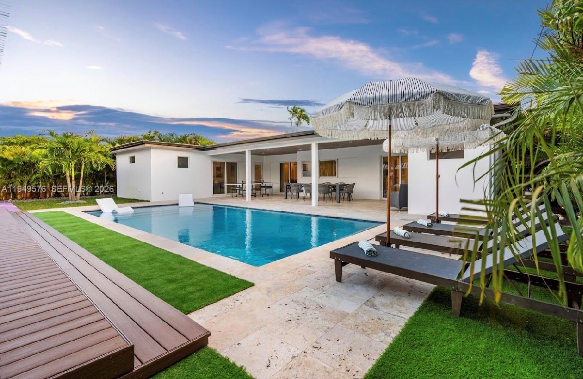 5111 Adams Street Hollywood, FL 33021 - Photo 15 of 66 swimming pool view with a outdoor seating