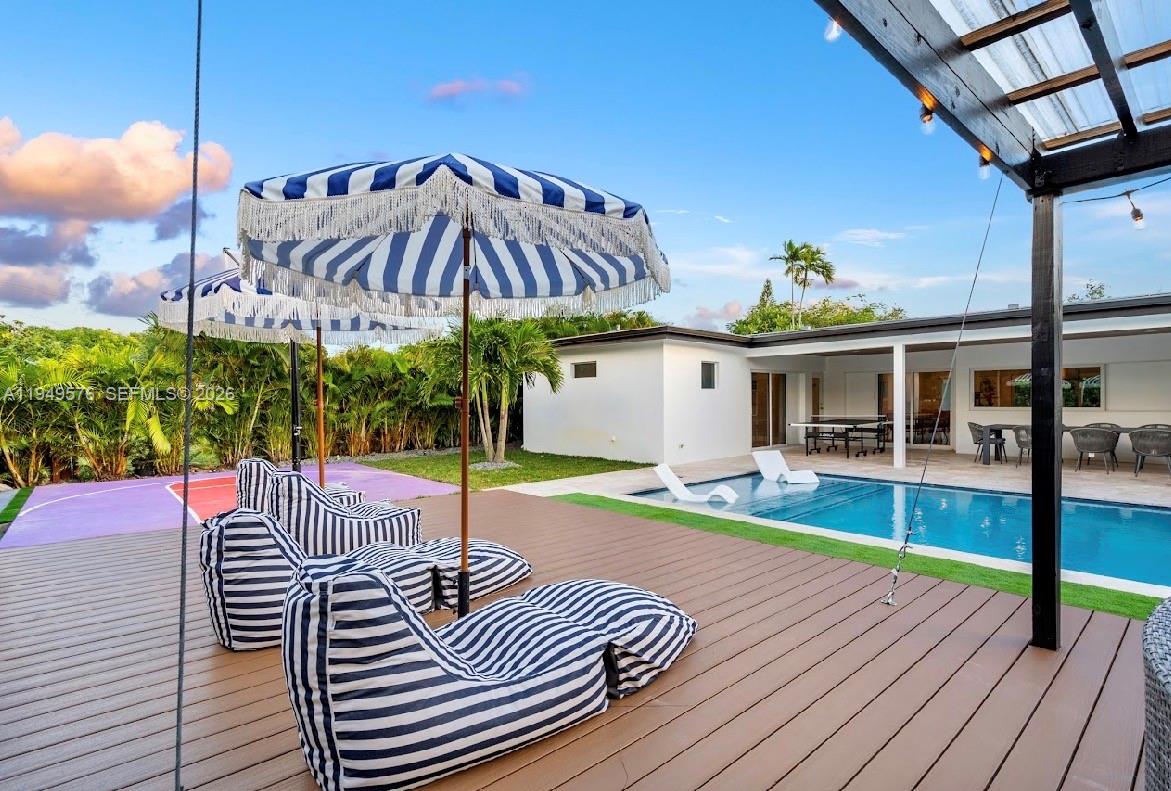 5111 Adams Street Hollywood, FL 33021 - Photo 20 of 66 a view of a roof deck with wooden floor