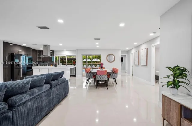 a kitchen with refrigerator and cabinets