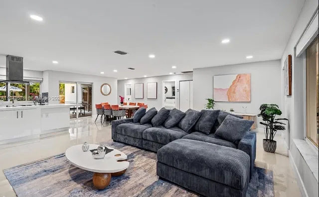 a bedroom with a bed and a wall painting