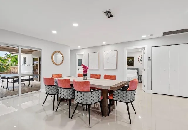 a bedroom with a large bed and a couch