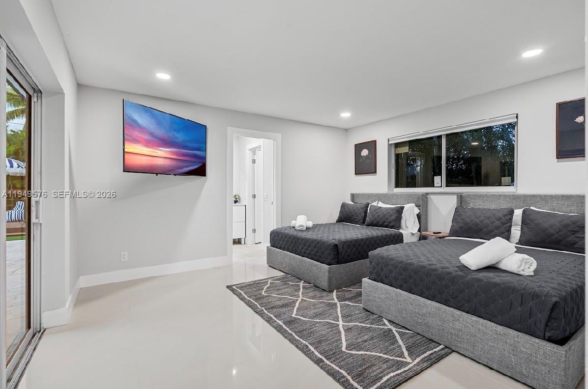5111 Adams Street Hollywood, FL 33021 - Photo 44 of 66 a living room with furniture and a flat screen tv