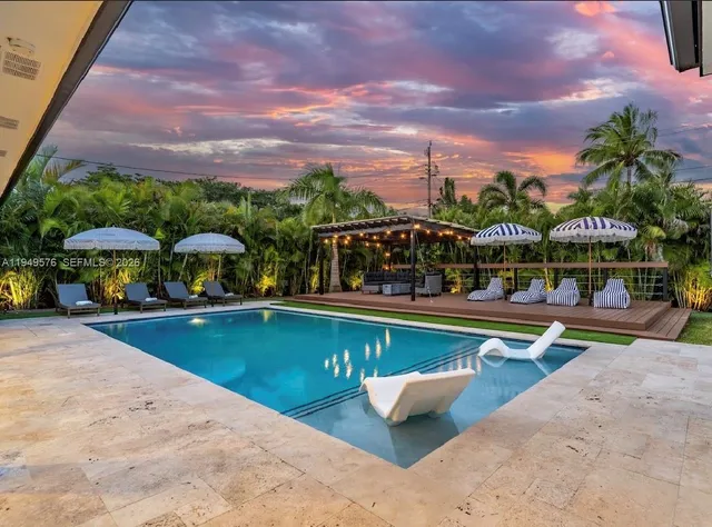 a view of a patio with a table chairs and a patio