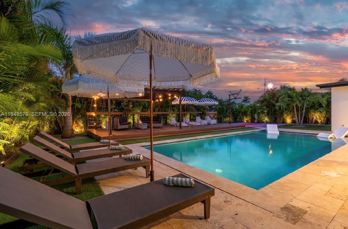 5111 Adams Street Hollywood, FL 33021 - Photo 63 of 66 a view of a swimming pool with a patio