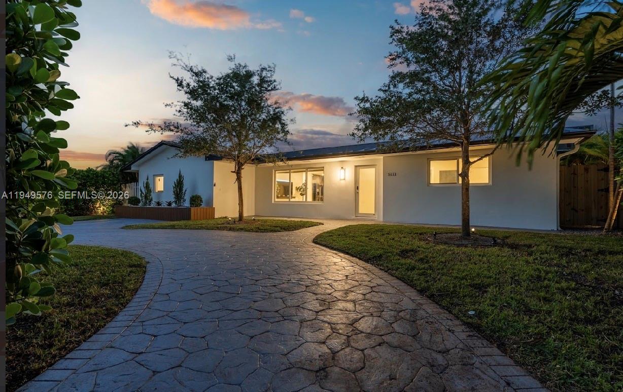 5111 Adams Street Hollywood, FL 33021 - Photo 64 of 66 a house view with a garden space