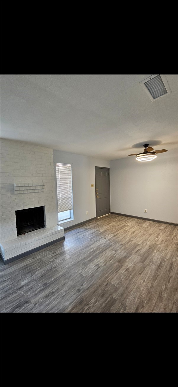 6702 Everhart Road, Unit K 104 Corpus Christi, TX 78413 - Photo 3 of 13 a view of empty room with wooden floor