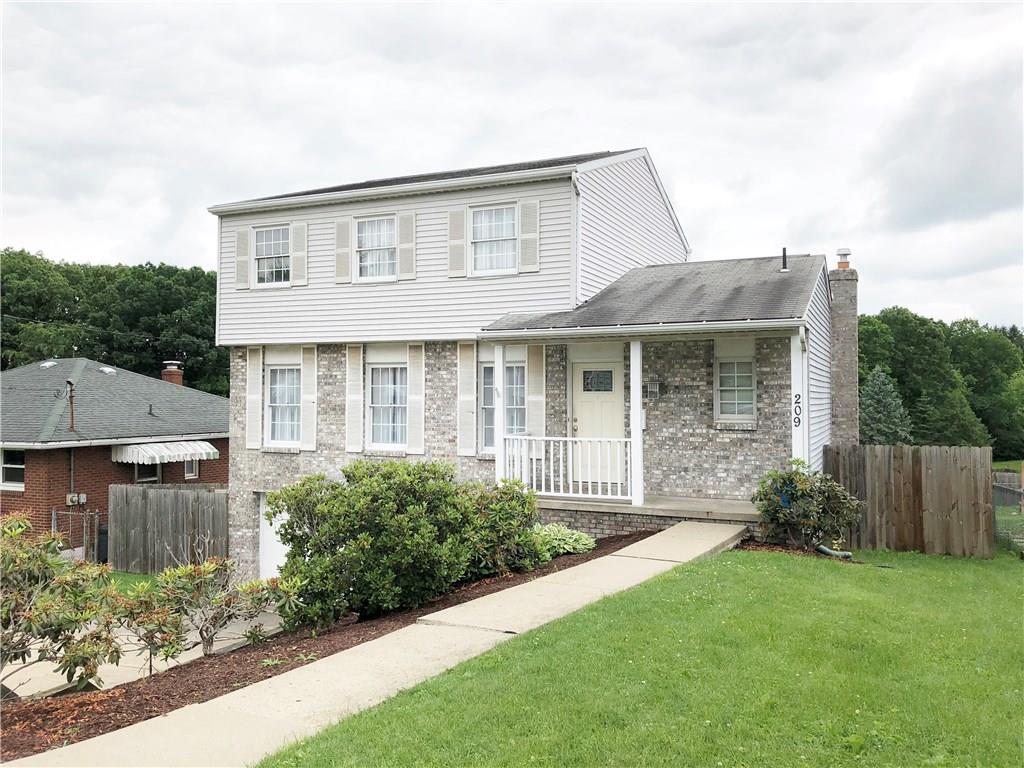 209 Donnell Road Lower Burrell, PA 15068 - Photo 22 of 22 Side view of home. Covered front porch.