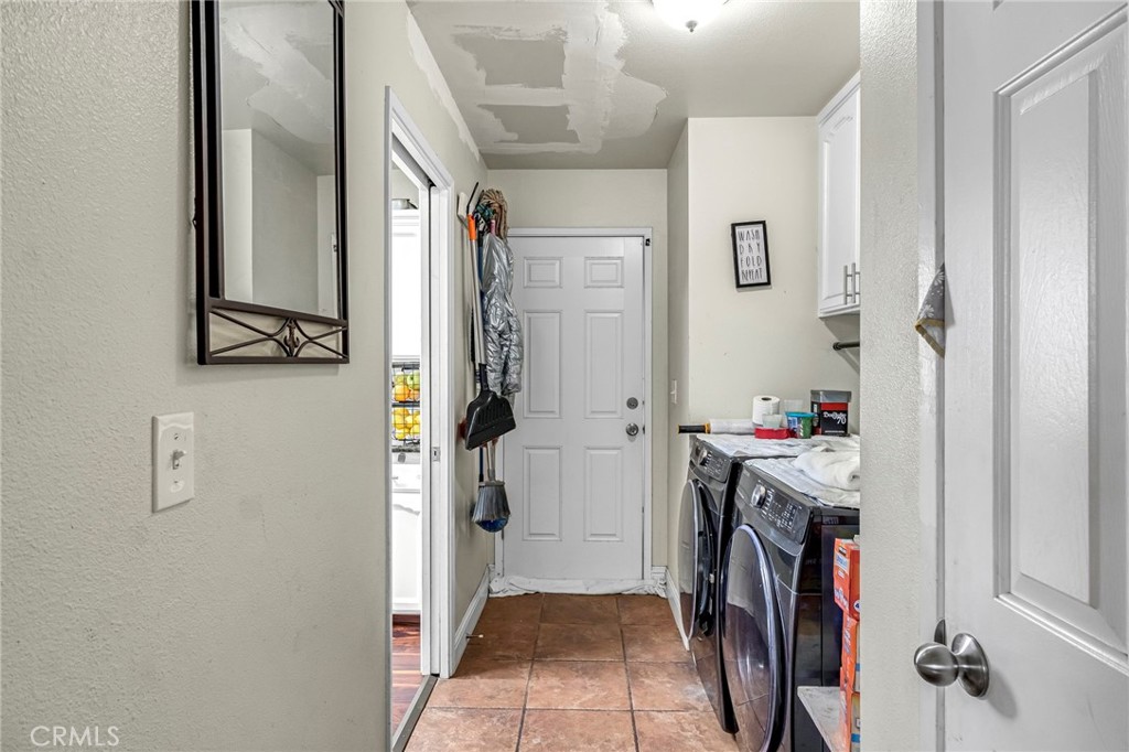 19729 Brightwood Road Madera, CA 93638 - Photo 15 of 33 a view of walk in closet with clothes and shoes