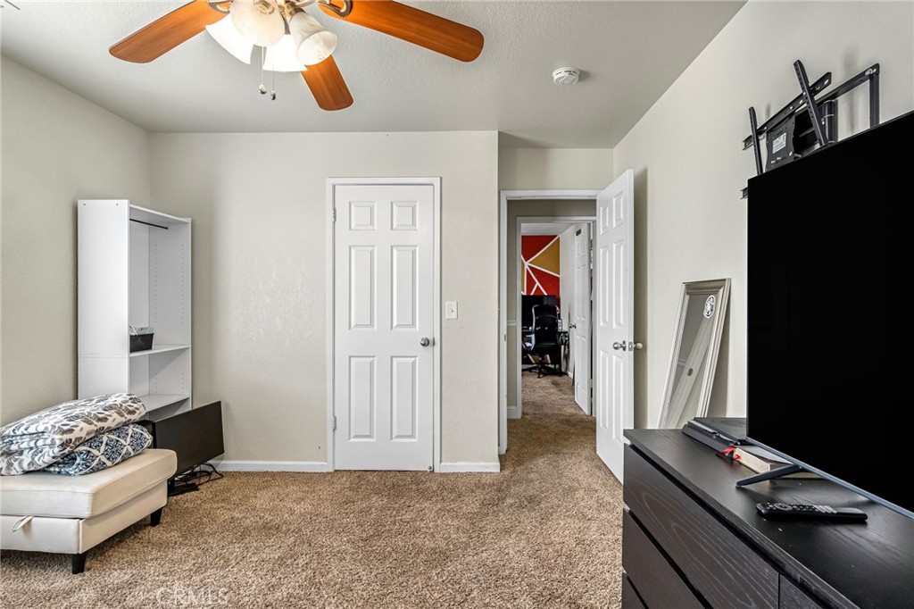19729 Brightwood Road Madera, CA 93638 - Photo 20 of 33 a bedroom with furniture and window