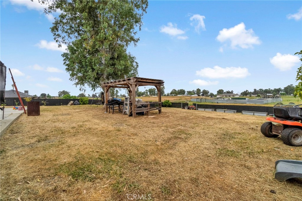 19729 Brightwood Road Madera, CA 93638 - Photo 27 of 33 a view of a lake with a car parked