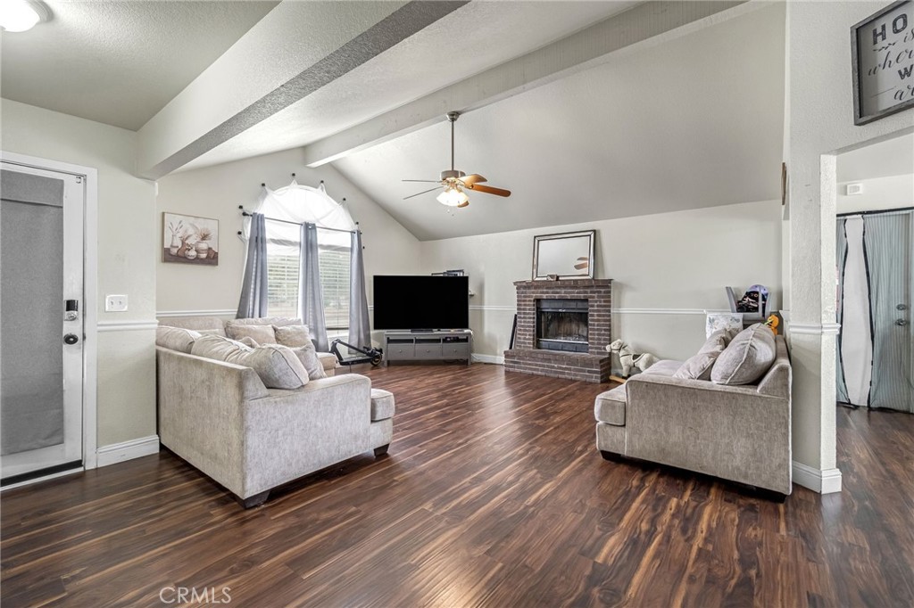 19729 Brightwood Road Madera, CA 93638 - Photo 6 of 33 a living room with furniture and a flat screen tv