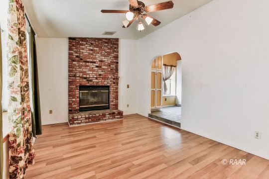 236 Richard Court Ridgecrest, CA 93555 - Photo 6 of 29 wooden floor in an empty room with a window