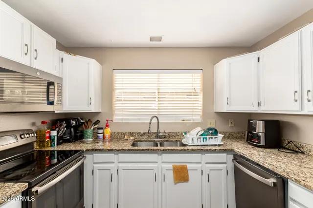 a workspace with furniture and window