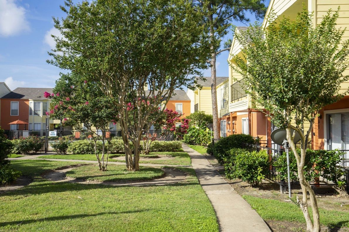2801 North Broadmead, Unit 1107 Houston, TX 77025 - Photo 5 of 15 a front view of a building with trees