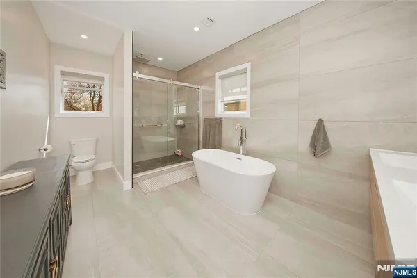 a bathroom with a toilet sink and shower