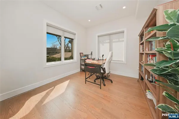 a work room with furniture and a window