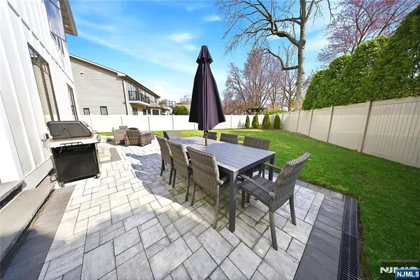 a view of yard with patio