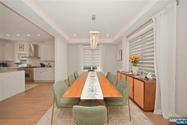 a room with kitchen island granite countertop furniture and a kitchen view