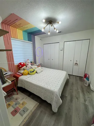 a bedroom with a bed and a table