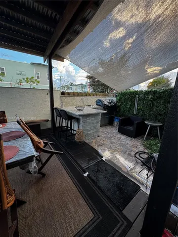 a view of a backyard with sitting area