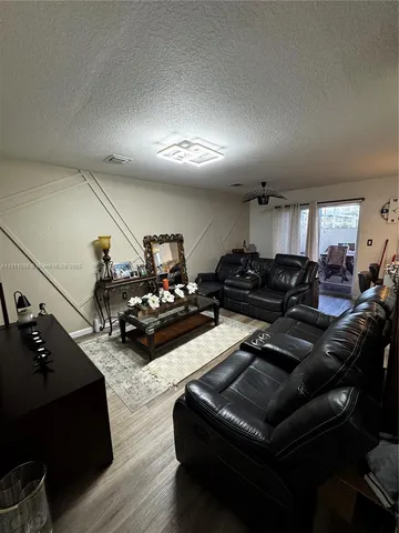 a living room with furniture and a view of living room