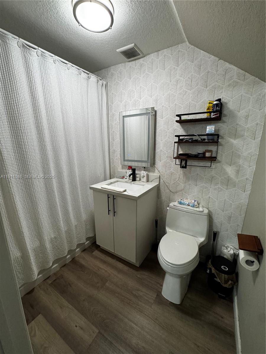 167 Southwest 6th Lane Florida City, FL 33034 - Photo 10 of 19 a bathroom with a sink toilet and shower