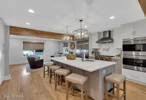 a large kitchen with a table and chairs