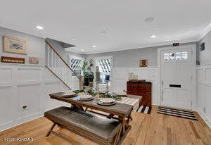 a view of a livingroom with furniture and a dining table