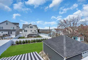 a view of house with yard and entertaining space
