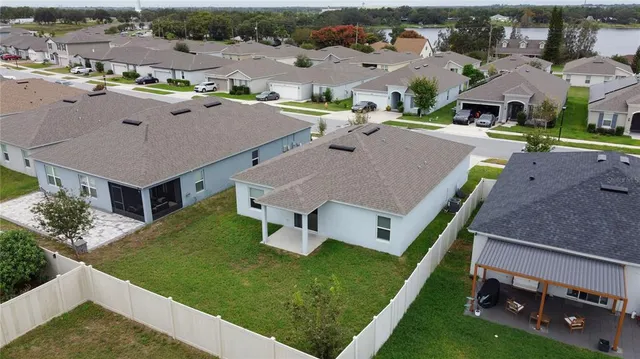 an aerial view of a house with a garden