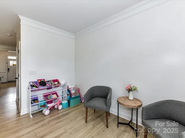 a kids room with toys and wooden floor