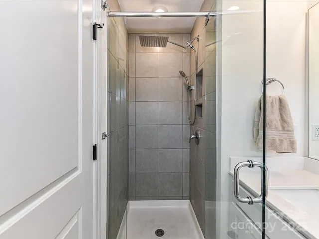 a bathroom with a shower and a tub