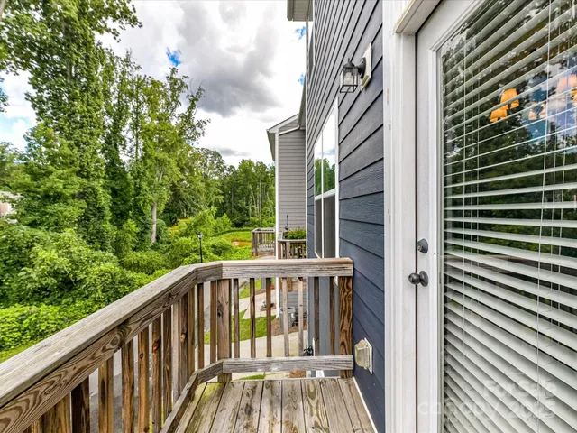 a view of balcony with furniture