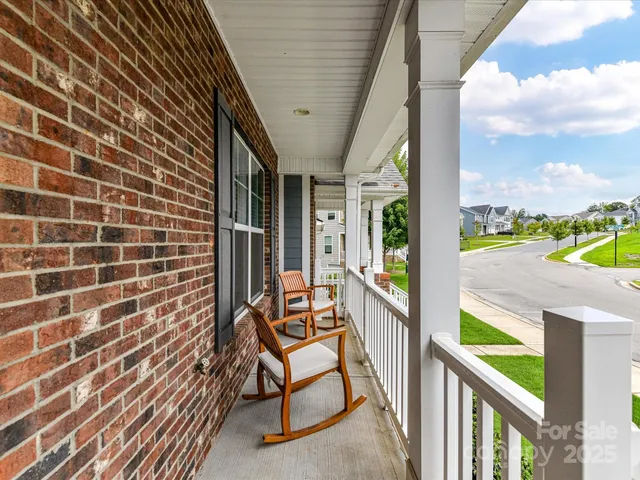 a view of a balcony with chairs