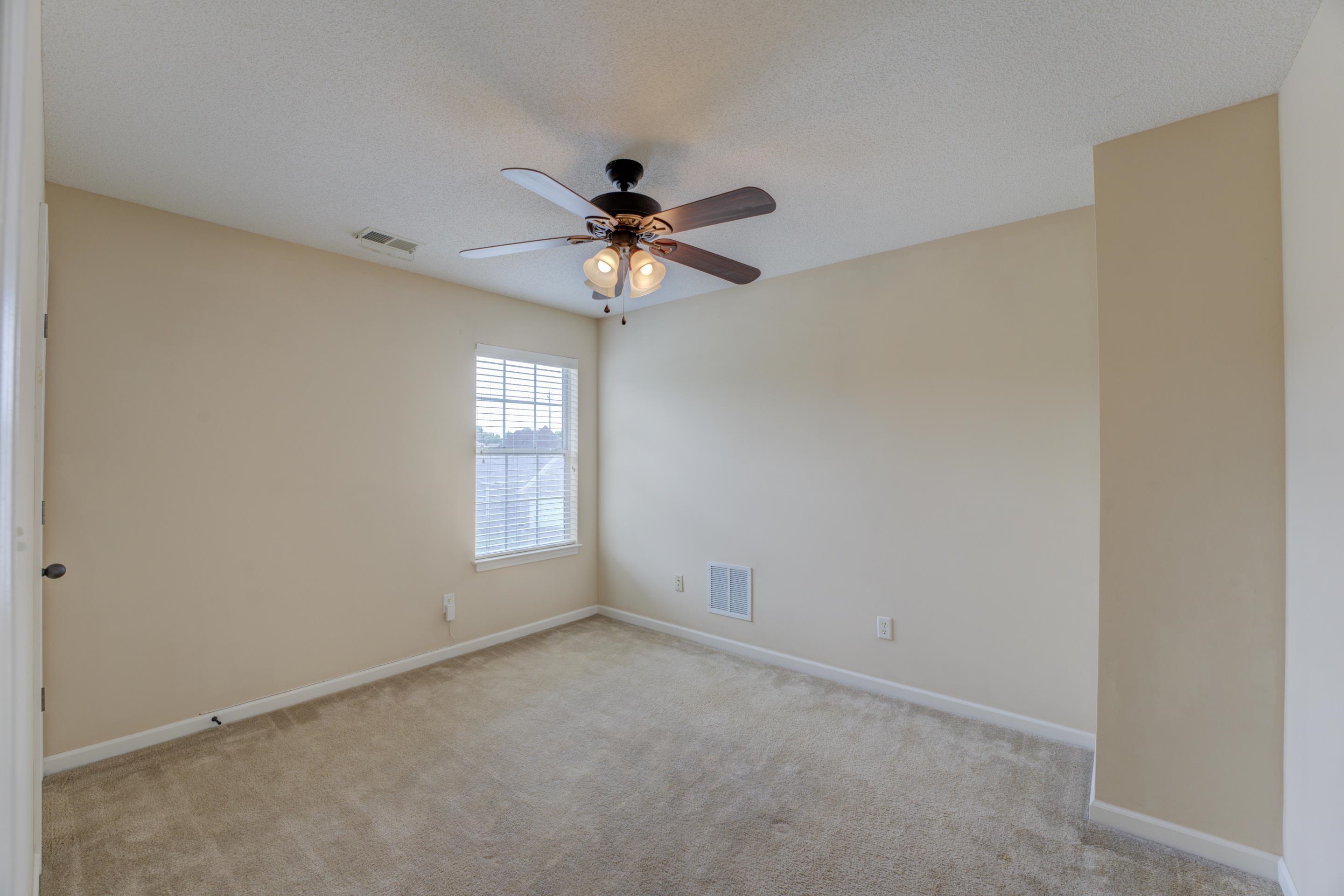 7243 Grapetree Trail Cordova, TN 38018 - Photo 18 of 20 a view of room with a ceiling fan and window