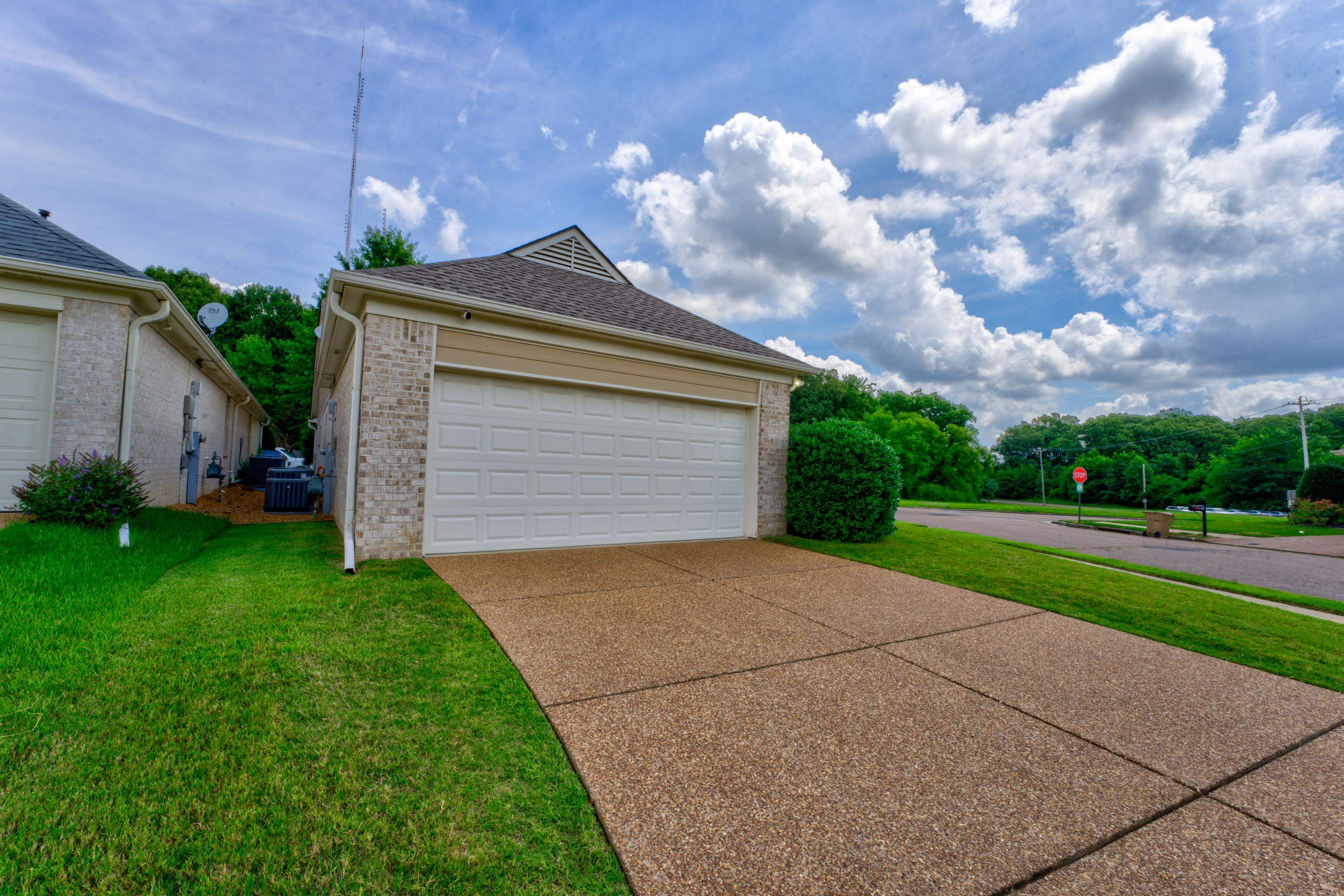 7243 Grapetree Trail Cordova, TN 38018 - Photo 2 of 20 a front view of house with yard and green space