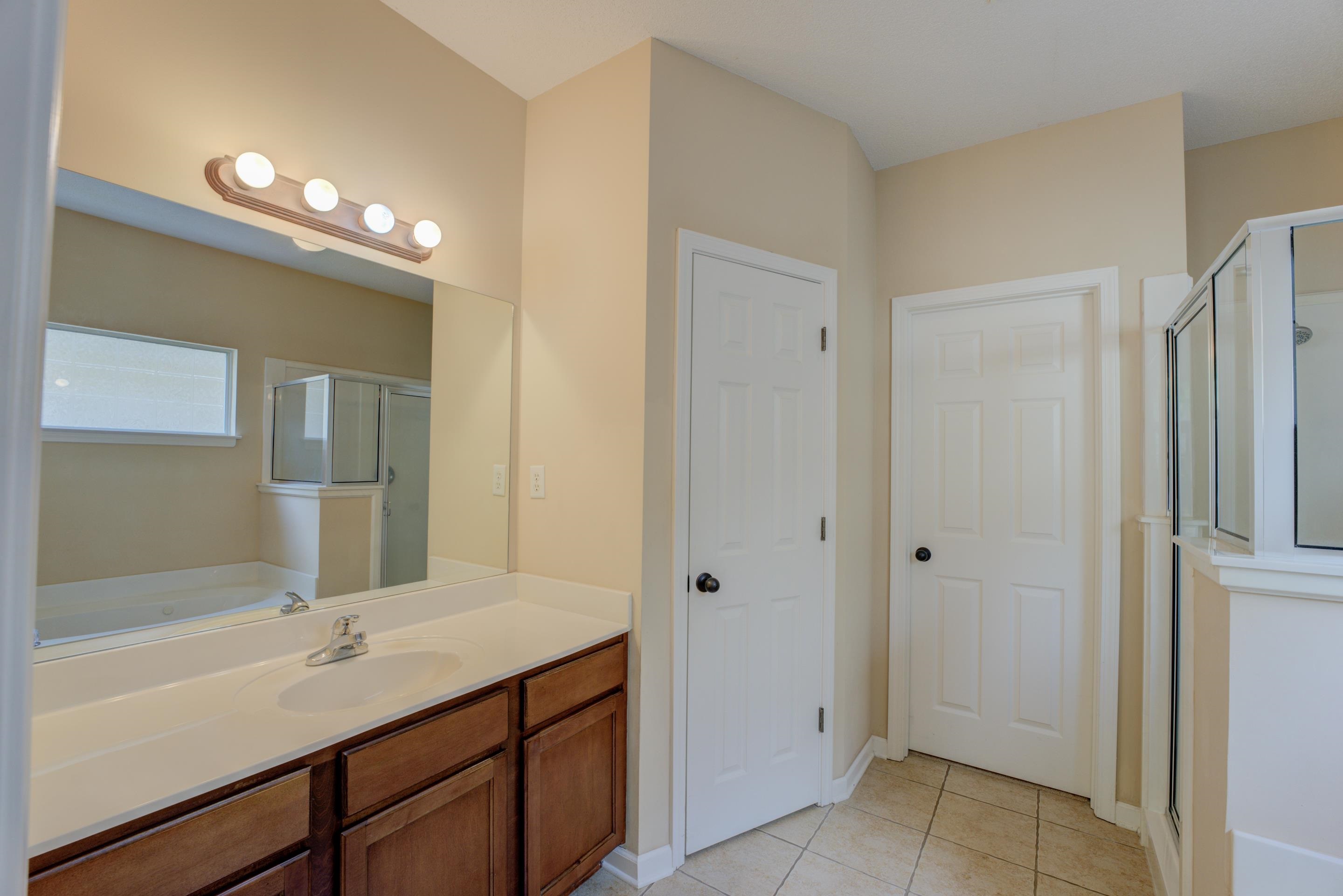 7243 Grapetree Trail Cordova, TN 38018 - Photo 6 of 20 a bathroom with a sink and mirror