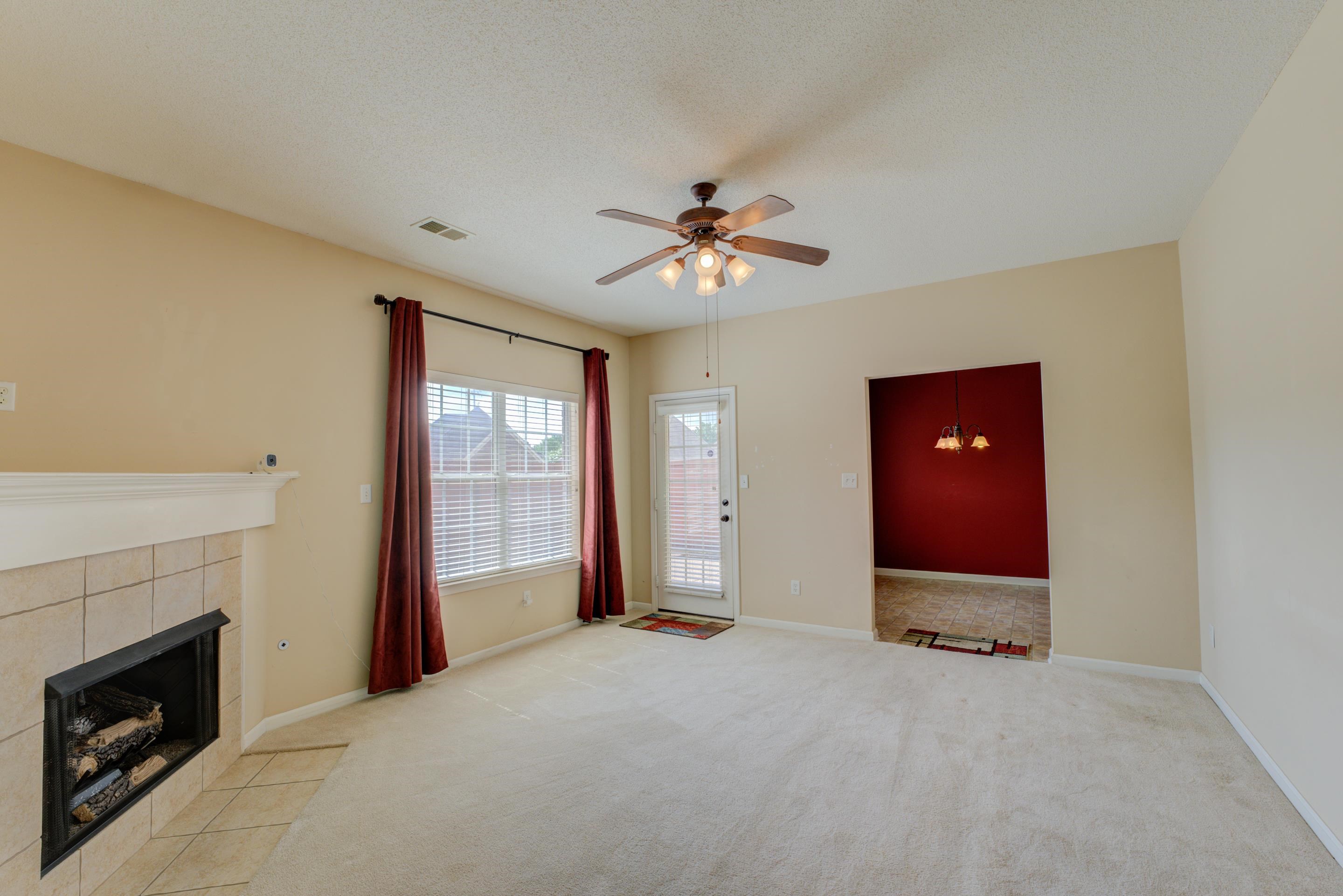 7243 Grapetree Trail Cordova, TN 38018 - Photo 8 of 20 a view of an empty room with a fireplace