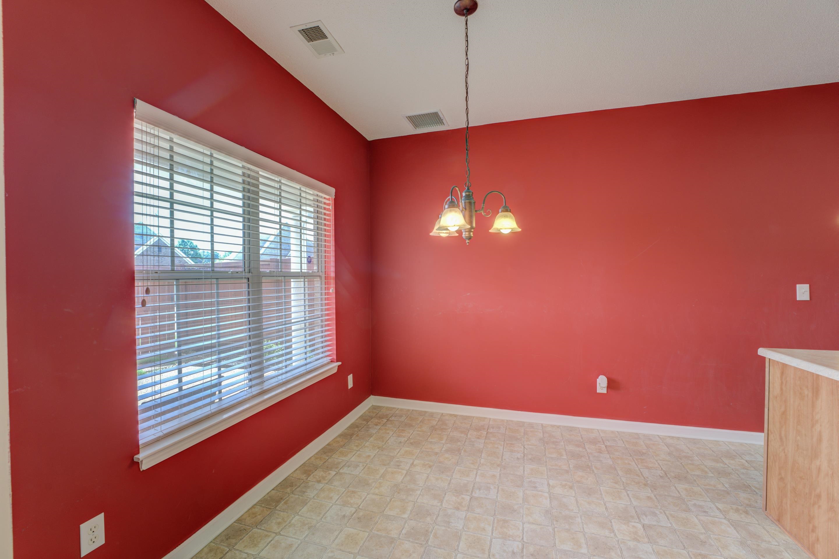 7243 Grapetree Trail Cordova, TN 38018 - Photo 10 of 20 a view of empty room with windows and chandelier